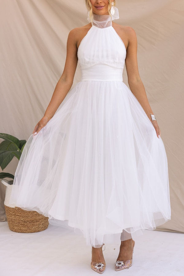 Fidelia - Halter midi jurk met volumineuze rok