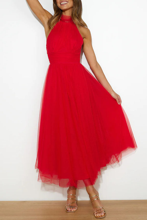 Fidelia - Halter midi jurk met volumineuze rok