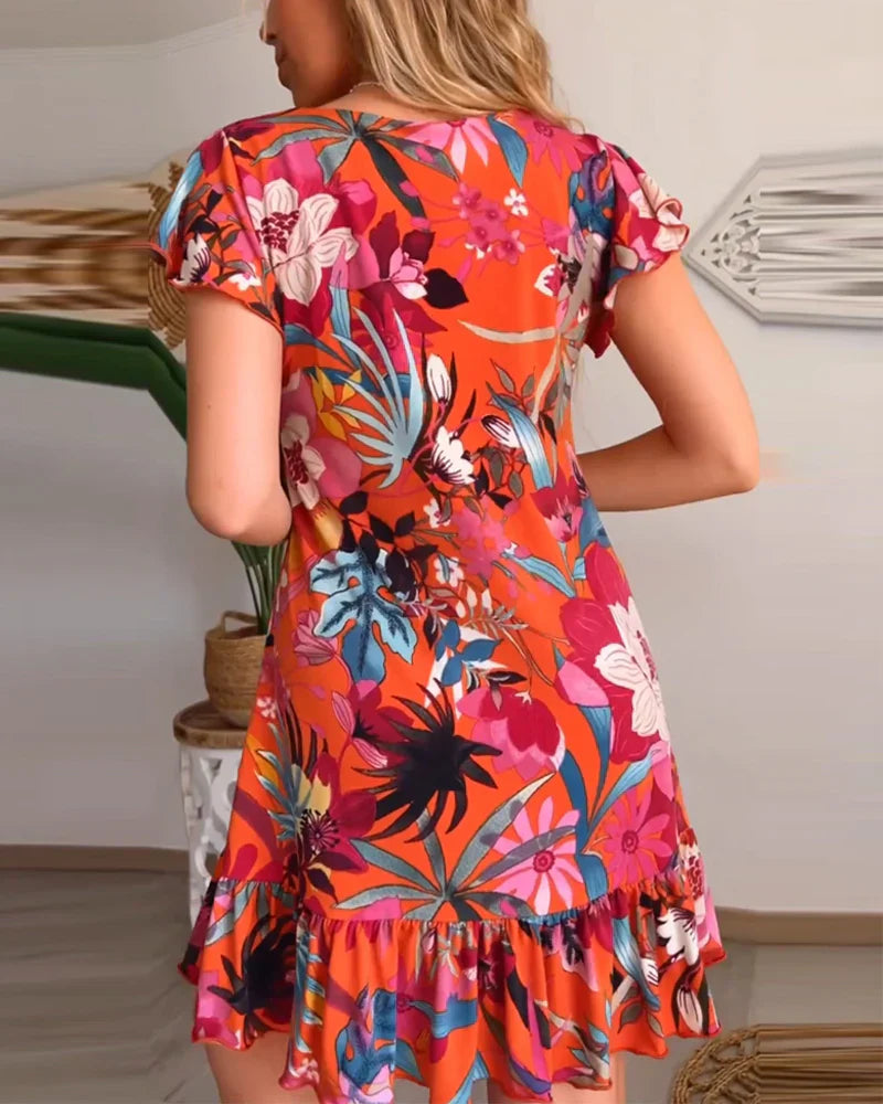 Nirella - Dames korte zomerjurk met v-hals, ruches en speelse mouw