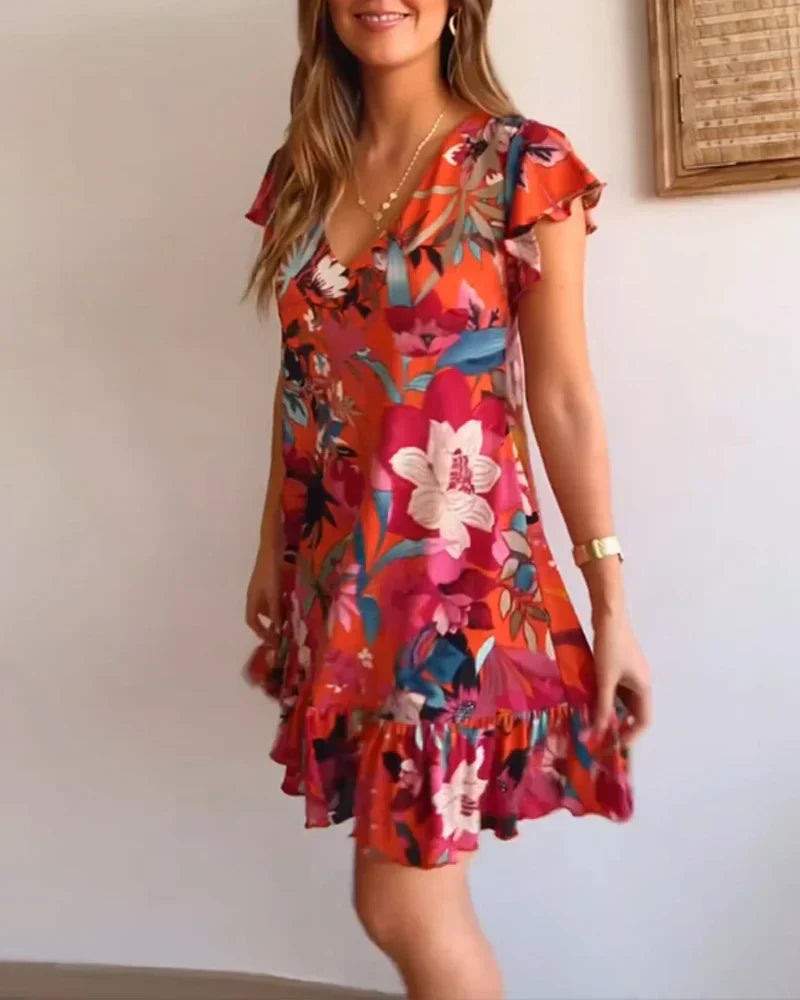 Nirella - Dames korte zomerjurk met v-hals, ruches en speelse mouw
