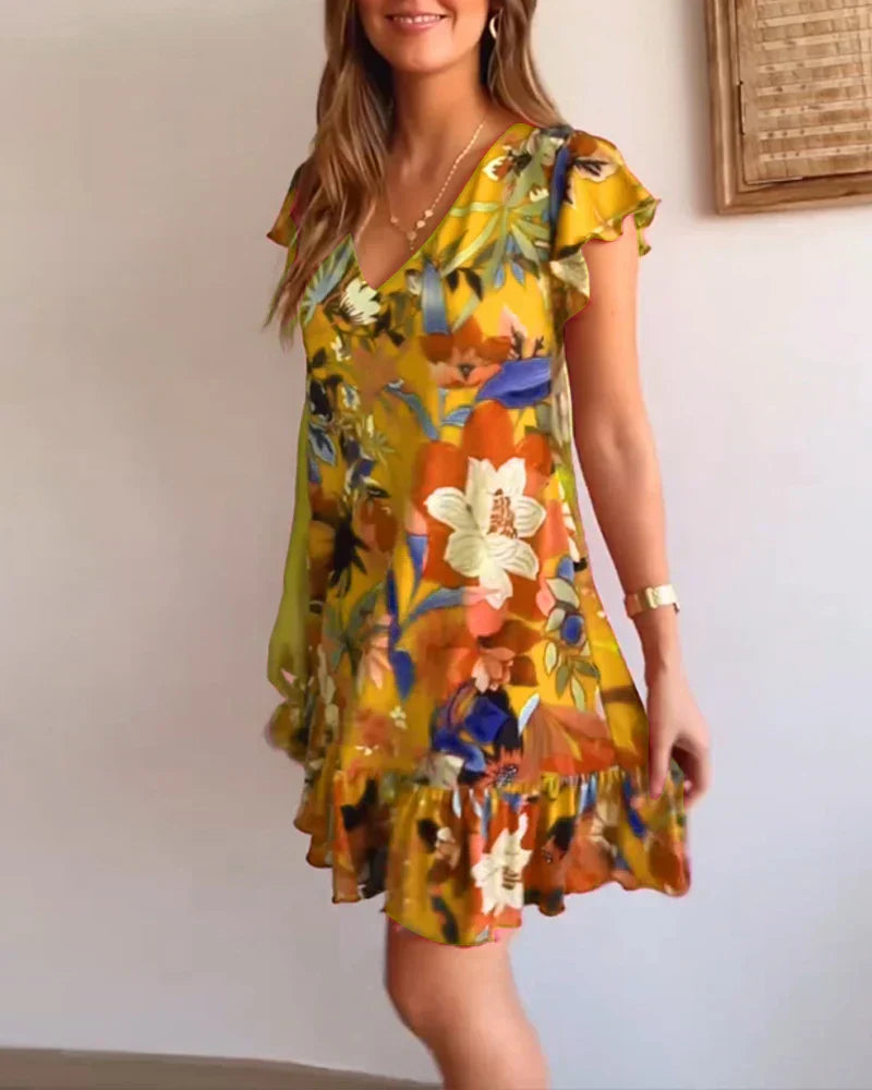 Nirella - Dames korte zomerjurk met v-hals, ruches en speelse mouw