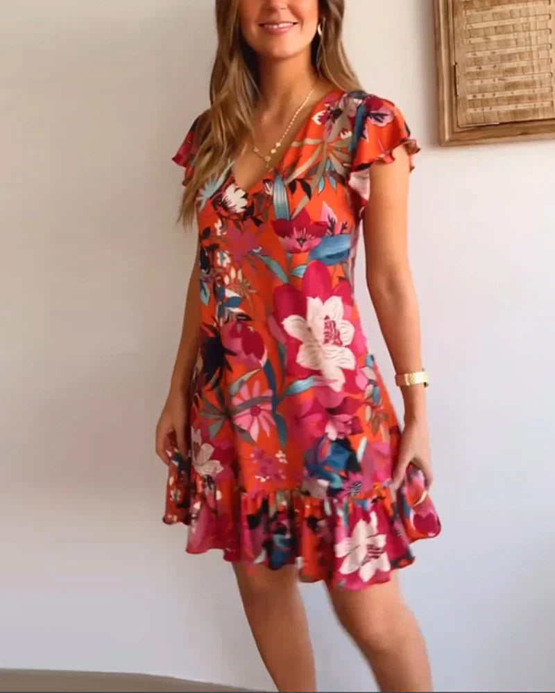 Nirella - Dames korte zomerjurk met v-hals, ruches en speelse mouw