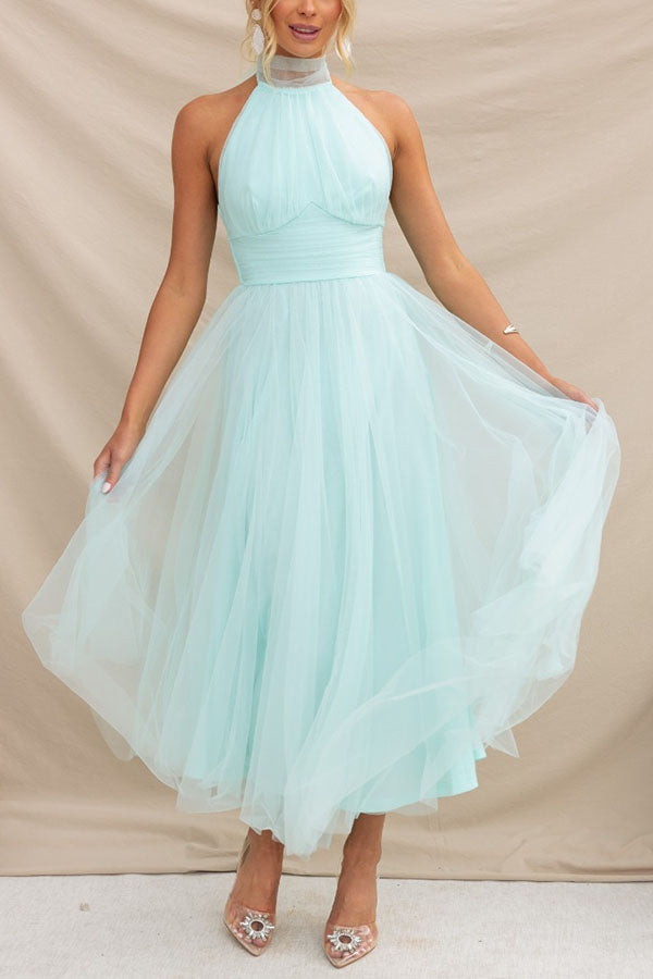 Fidelia - Halter midi jurk met volumineuze rok