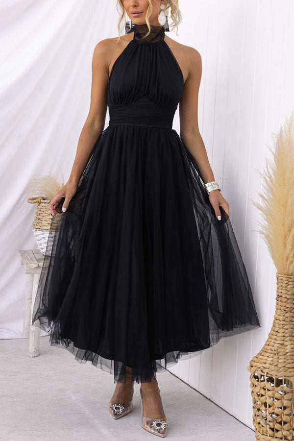 Fidelia - Halter midi jurk met volumineuze rok
