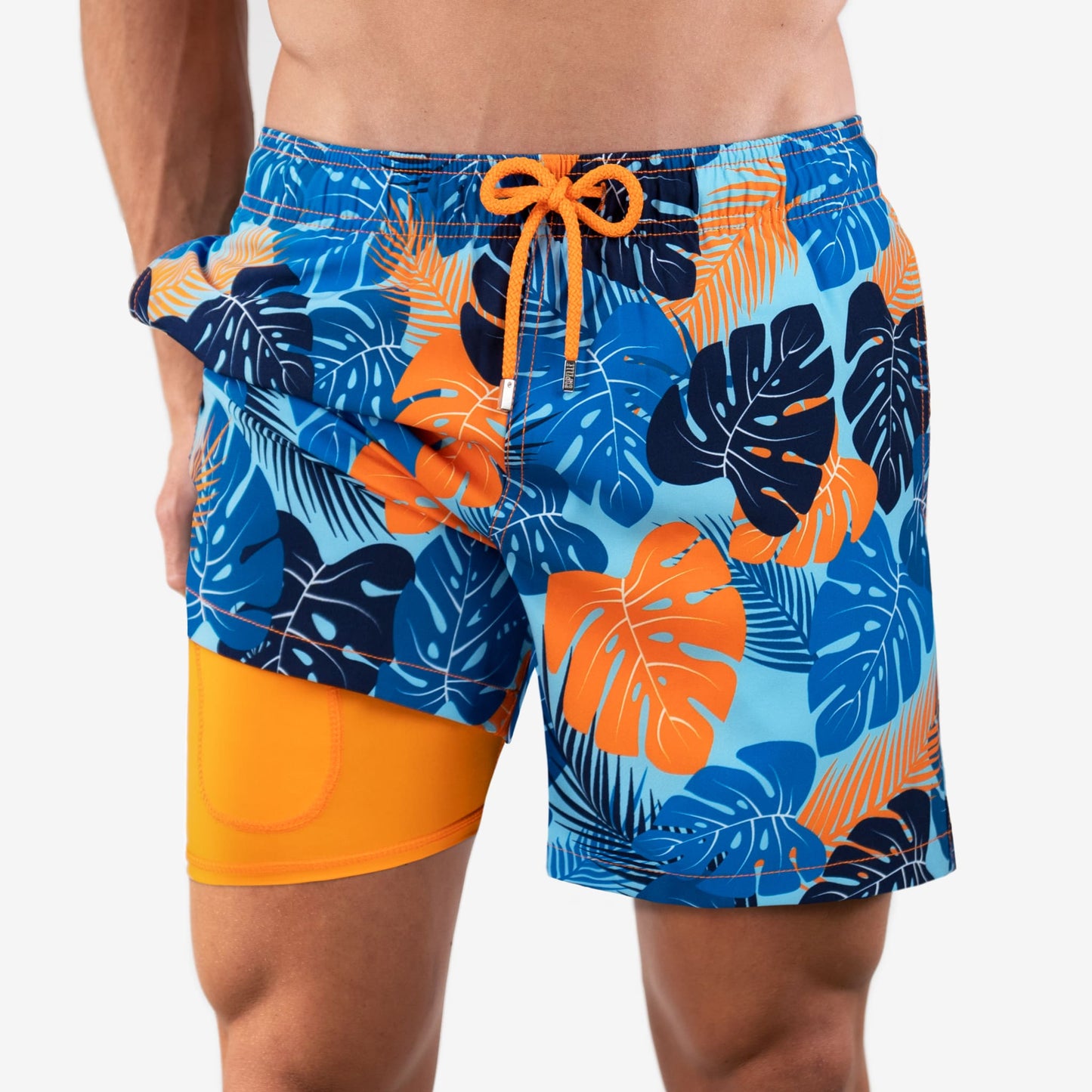 Fionn - Heren mid-length zwemshort met tropisch bladerpatroon en binnenbroek