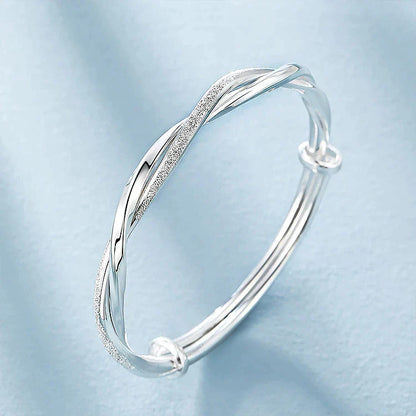 Damesarmband met gevlochten glans en vloeiende twist