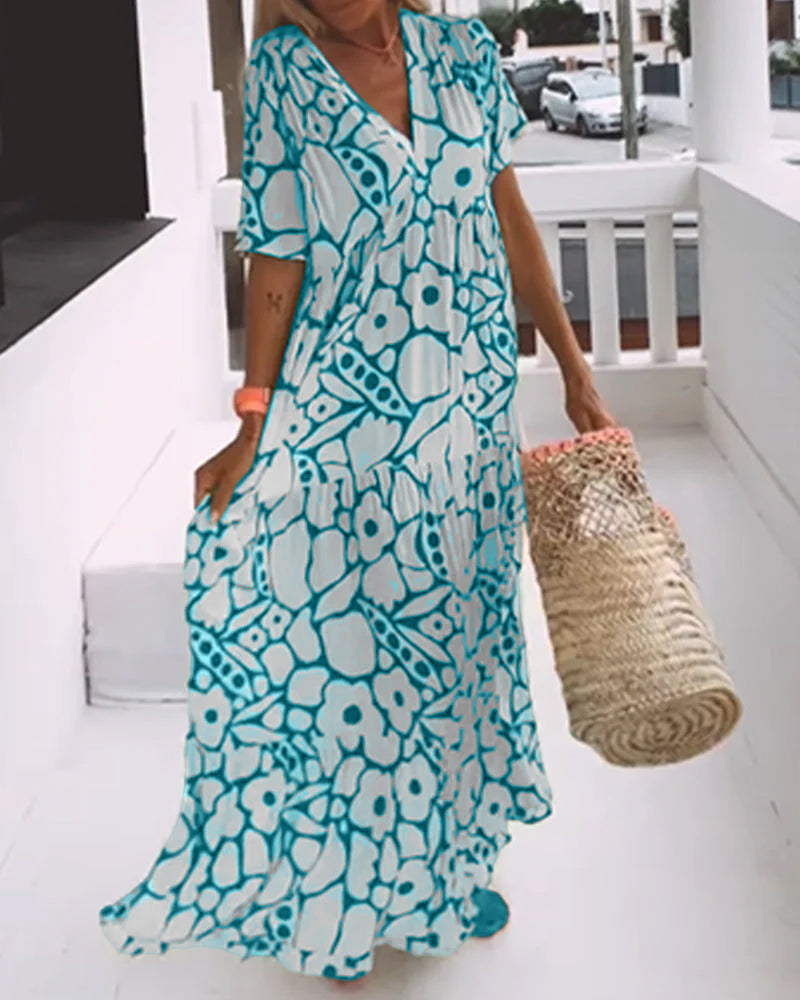 Melania – Luchtige maxi-jurk met abstracte bloemenprint