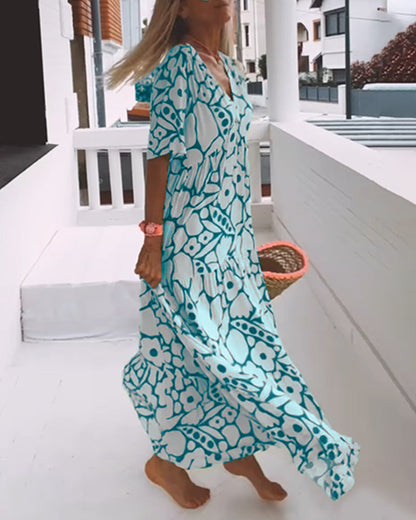Melania – Luchtige maxi-jurk met abstracte bloemenprint