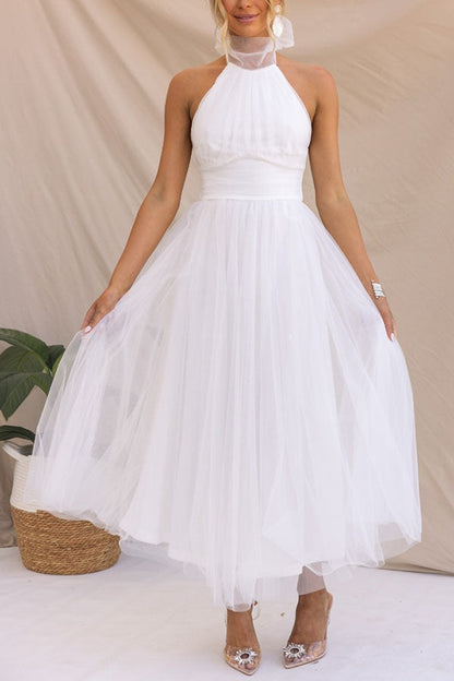 Fidelia - Halter midi jurk met volumineuze rok