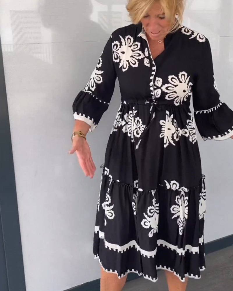 Claudette – Vrouwelijke midi-jurk met grafisch borduurmotief