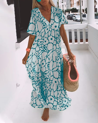 Melania – Luchtige maxi-jurk met abstracte bloemenprint