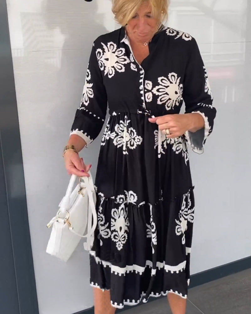 Claudette – Vrouwelijke midi-jurk met grafisch borduurmotief