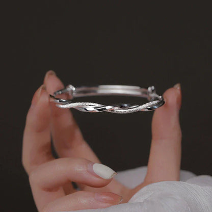Damesarmband met gevlochten glans en vloeiende twist