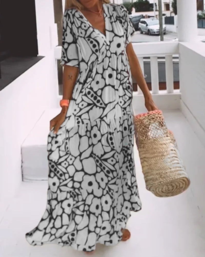 Melania – Luchtige maxi-jurk met abstracte bloemenprint