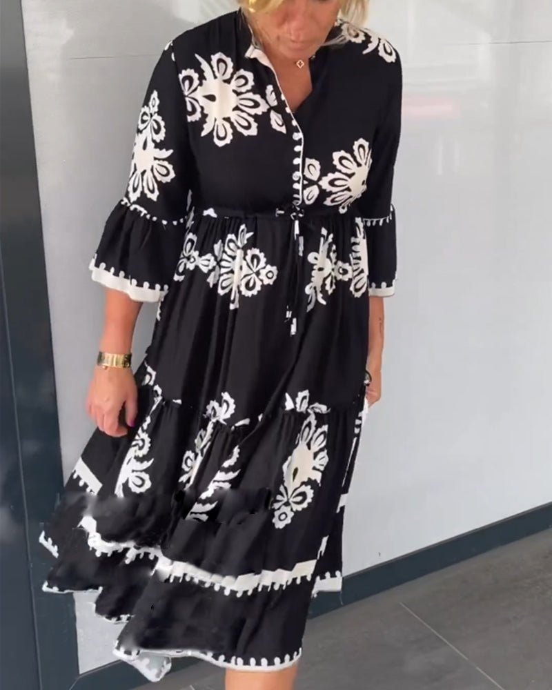 Claudette – Vrouwelijke midi-jurk met grafisch borduurmotief