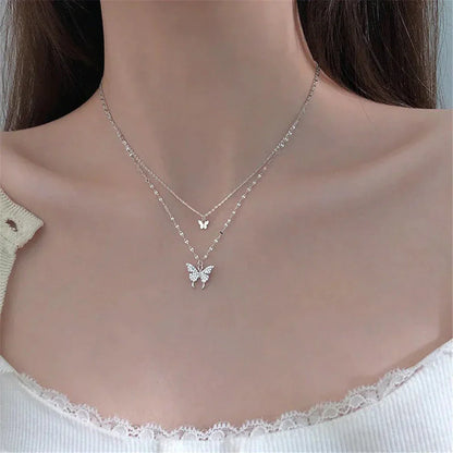 Damesketting met dubbele laag en vlinderdetails