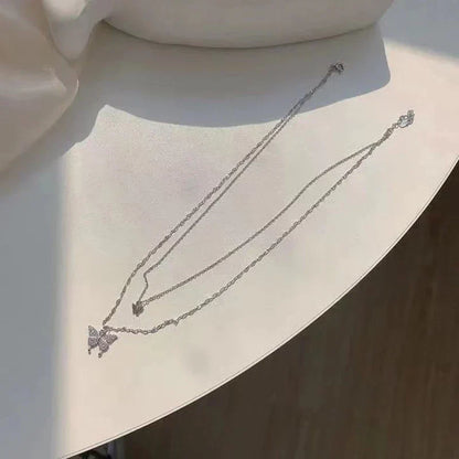 Damesketting met dubbele laag en vlinderdetails