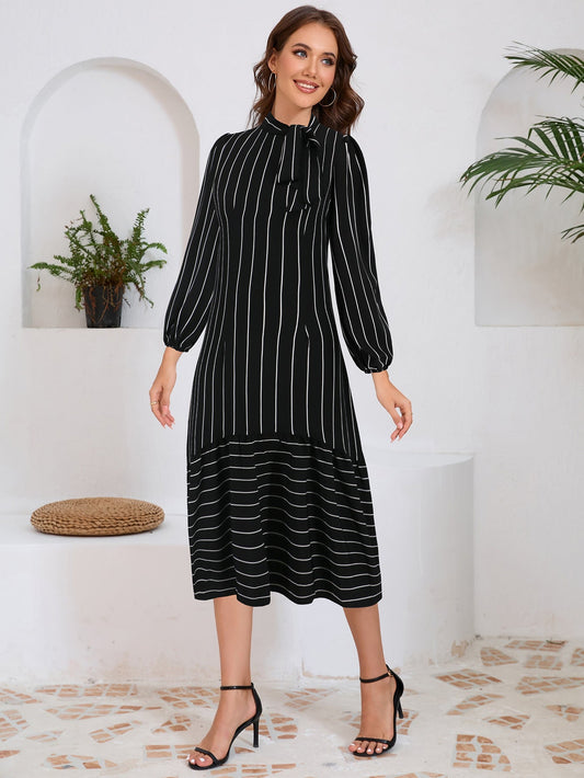 Alazne - Midi jurk met strikdetail en lange mouwen