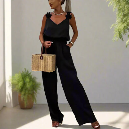 Ursula - Dames mouwloze jumpsuit met bloemenbandjes en wijde pijpen