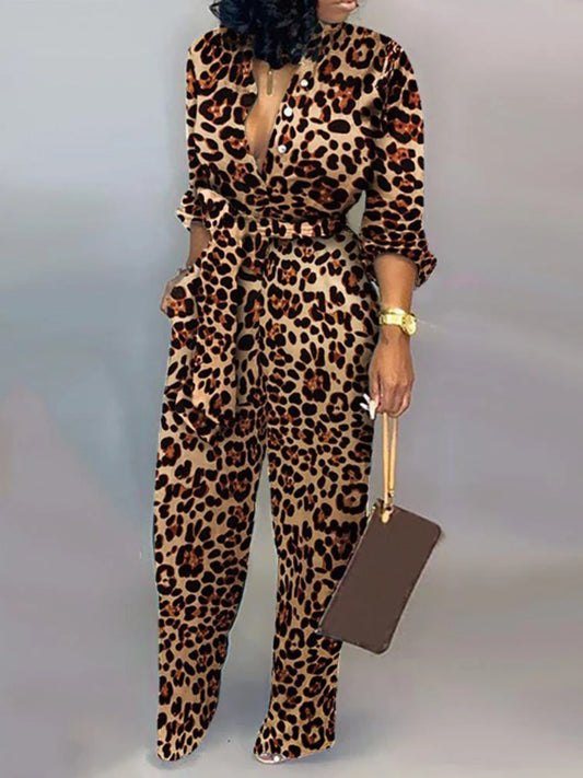 Aessia – Wijde damesjumpsuit met strikceintuur en diepe halslijn