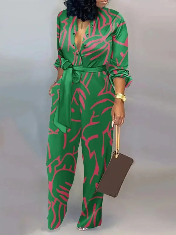 Aessia – Wijde damesjumpsuit met strikceintuur en diepe halslijn