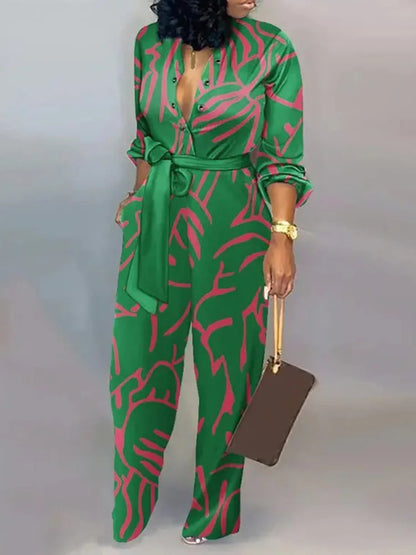 Aessia – Wijde damesjumpsuit met strikceintuur en diepe halslijn