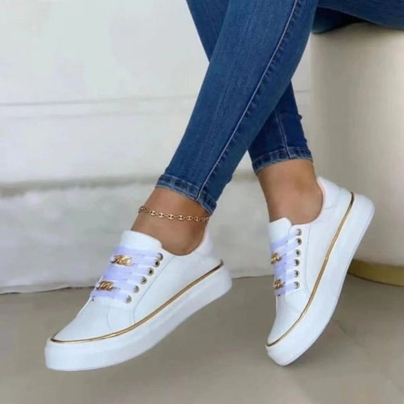 Kate – Lage damessneakers met gouden accenten