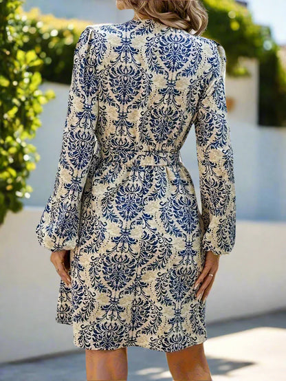 Charlotte – Dames wikkeljurk met lange mouwen en tailleaccent