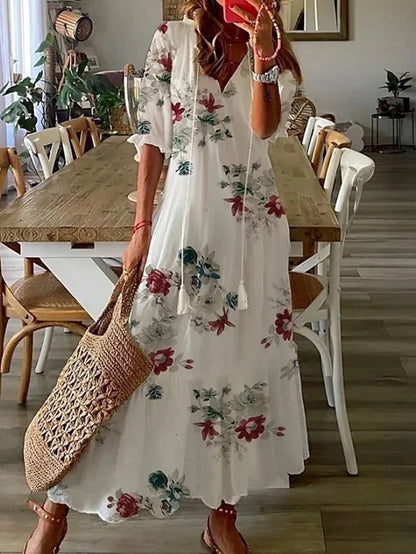 Isabella – Lange bloemenjurk met strikdetail en kraag voor dames